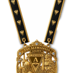Gold medal with black ribbon featuring gold eagles; reads TSV Alemannia Aachen with a crowned figure and ornate cityscape motif (club trophy medallion).