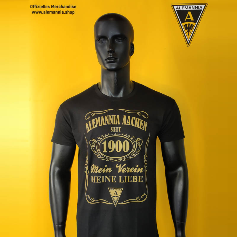 AATS63 Foto_800x800 - Alemannia Shop Black mannequin wearing a dark T-shirt with gold Alemannia Aachen graphics, yellow background with crest in top right and shop text top left