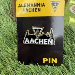Enamel pin with Alemannia Aachen crest on a yellow-and-black card