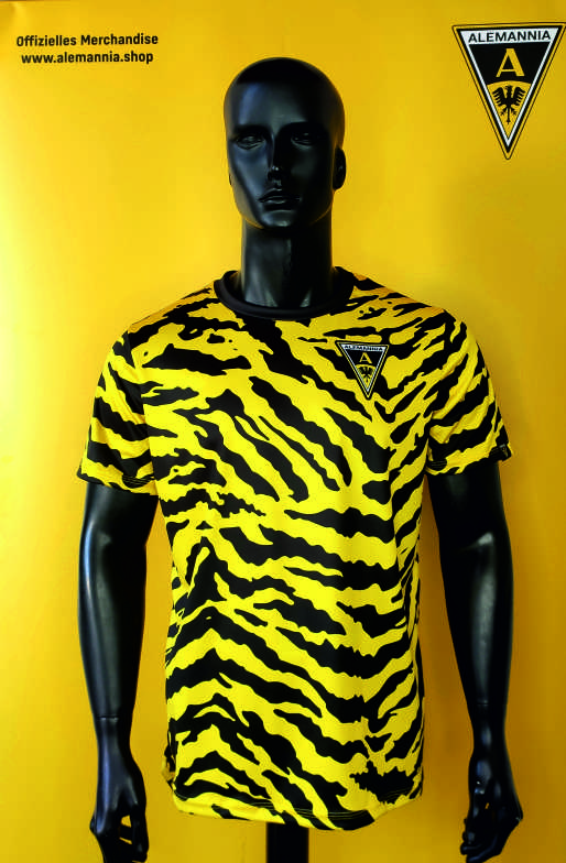 Mannequin wearing a yellow and black tiger-stripe Alemannia football jersey with the club crest on the chest.