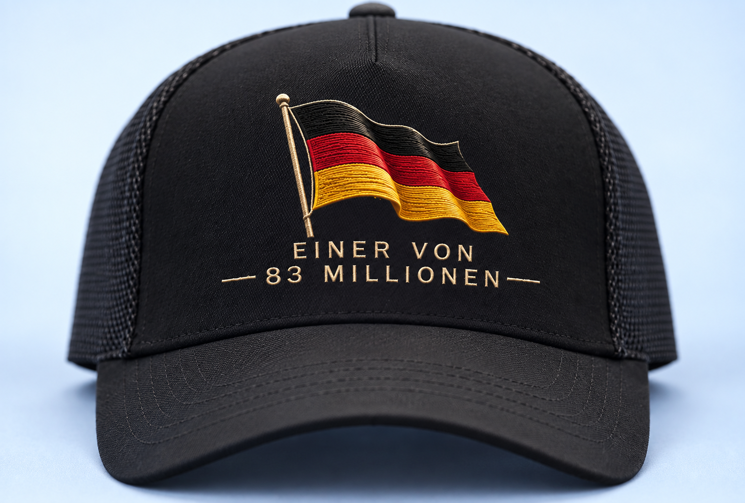 Black baseball cap with an embroidered German flag and the text “Einer von 83 Millionen” on the front.